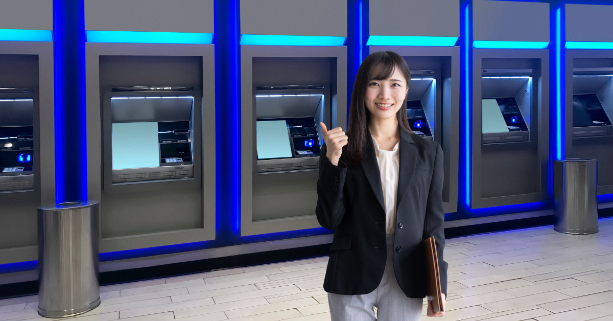 Japanese Woman Standing in Front of ATM