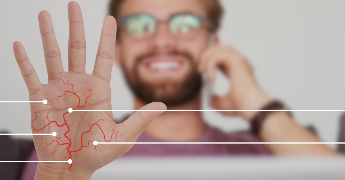 Man on Telephone holding up his palm showing veins
